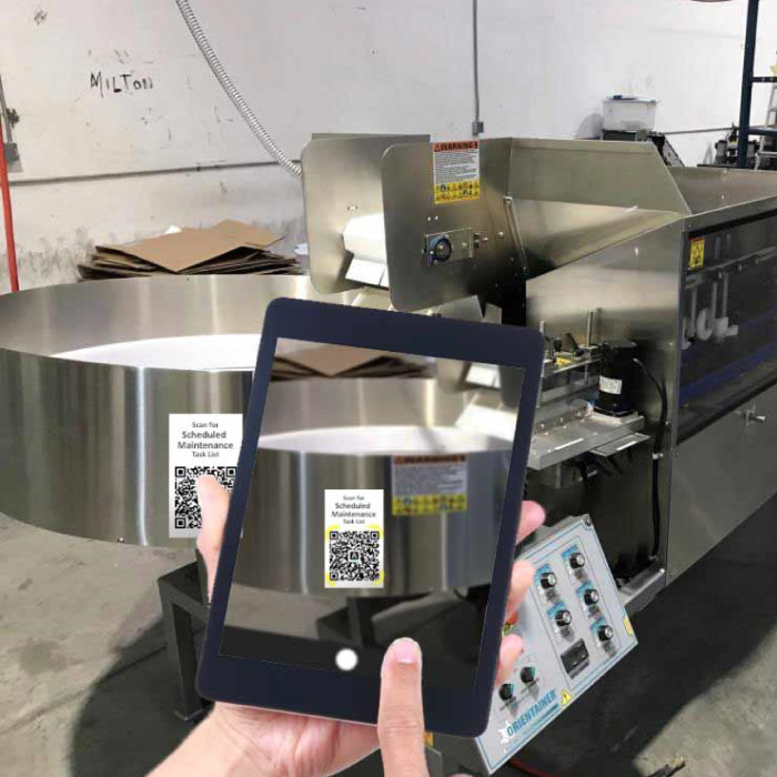 A person with a tablet scanning a QR