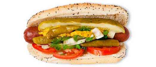 A hot dog on a bun with toppings