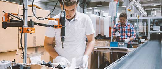 Two men working in an assembly line