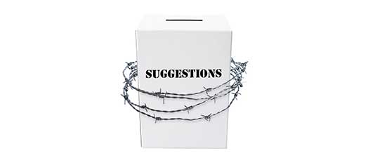 A suggestions box with barbed wire wrapped around it