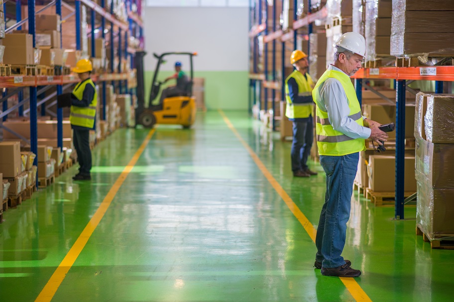 Warehouse workers checking inventory