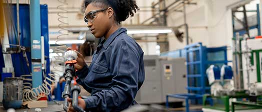 A woman assembling a product.