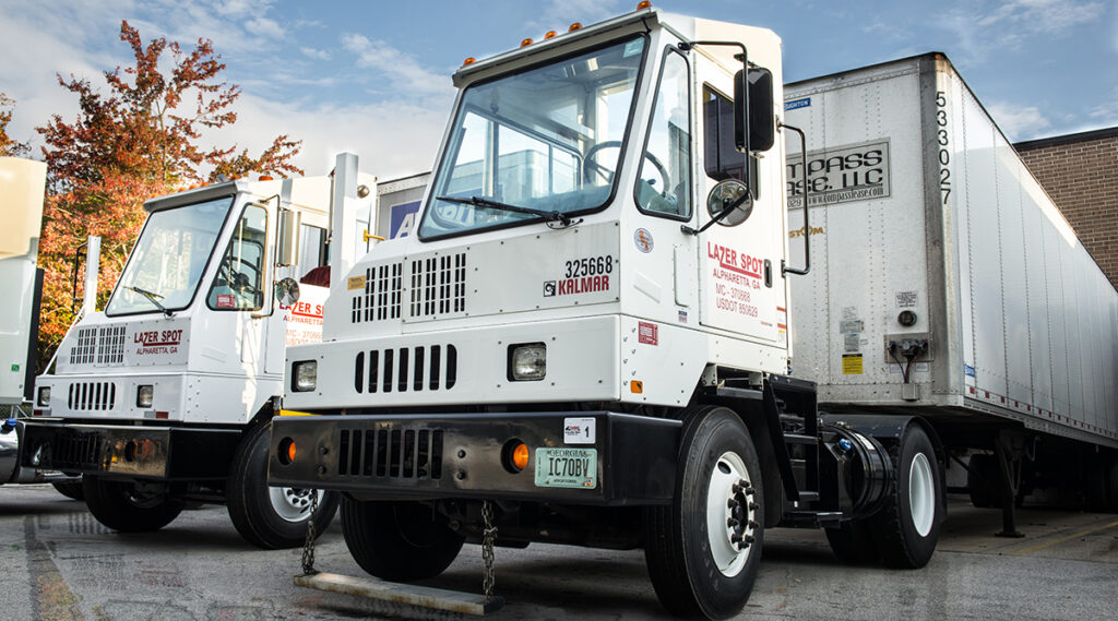 Two Lazer Spot trucks in loading bays.