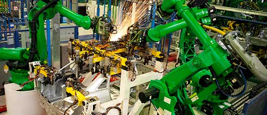 Two robots welding.