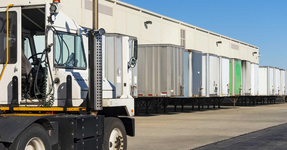 The outside view of a handful of truck loading bays.