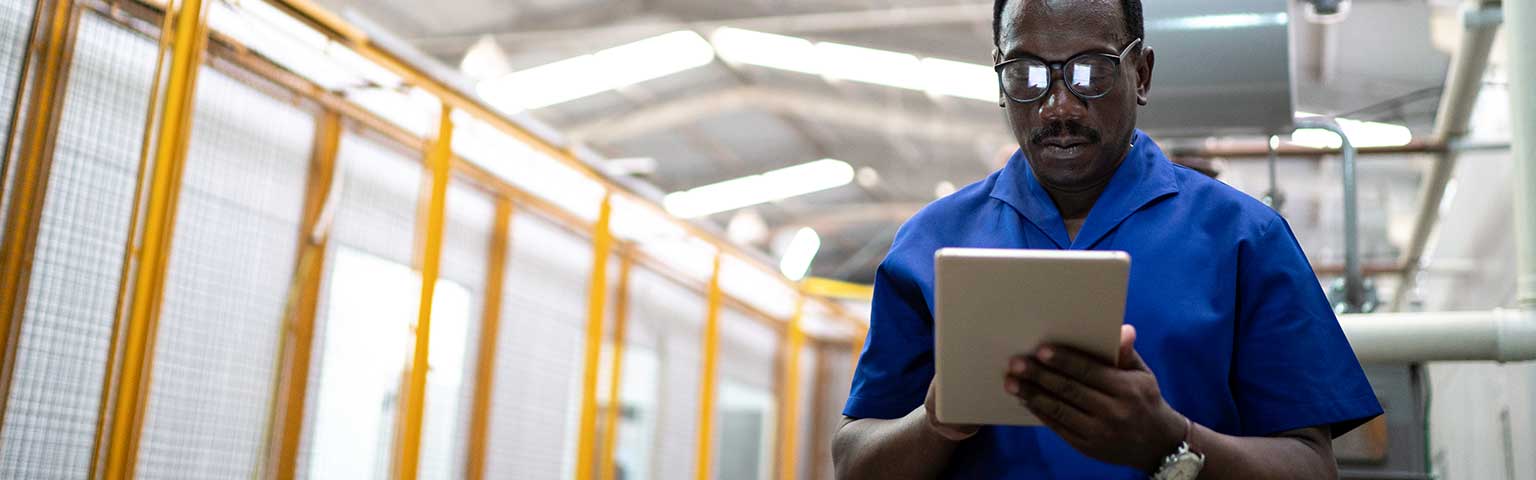 Man using tablet computer to access Acadia